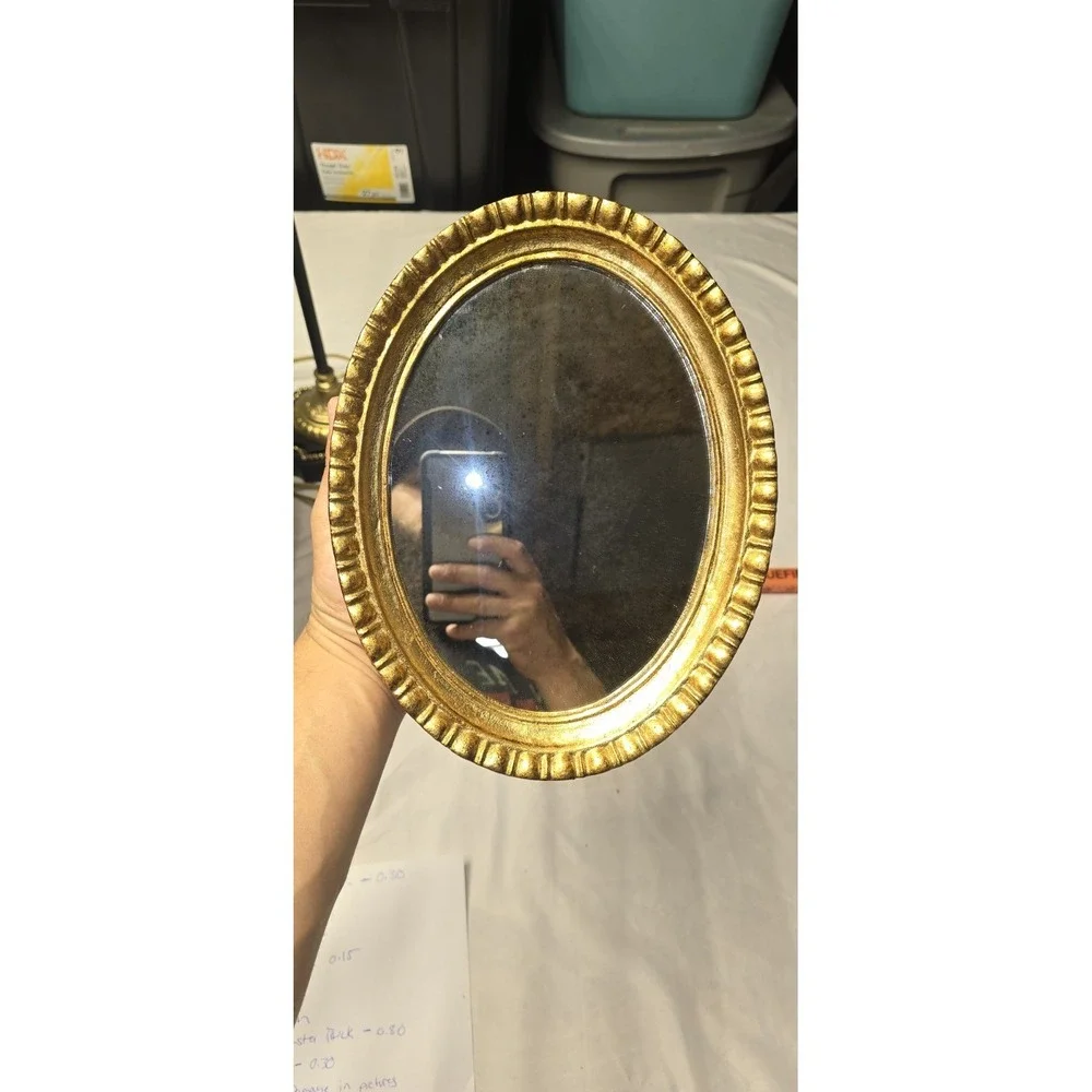 Vintage Or Antique Oval Wall Mirror with An Ornate Gold Gilt Frame